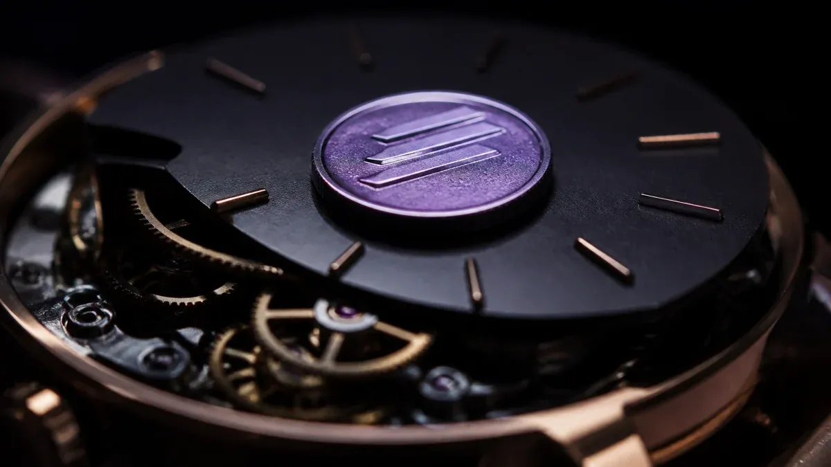Macro shot of a mechanical clockwork with a purple shimmering coin resting on it