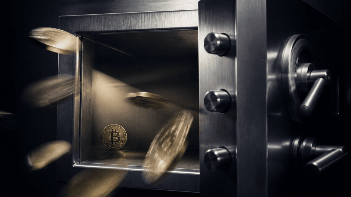 Half-open steel vault door, a single coin bearing the Bitcoin symbol remains in the compartment while further coins fly out of focus